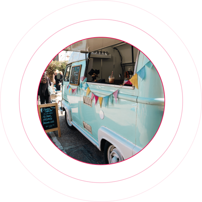 A light blue Volkswagen van parked on side of street that's converted to coffee serving food truck