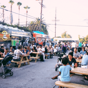 People eating at the First Friday Food Truck Fest Abbot Kinney Rd