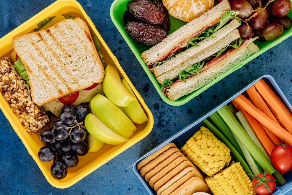 colorful lunch boxes on the table for school and work