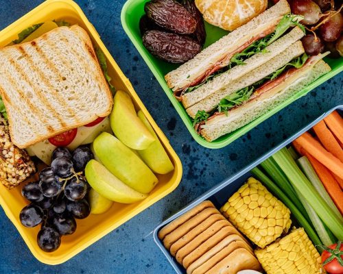 colorful lunch boxes on the table for school and work